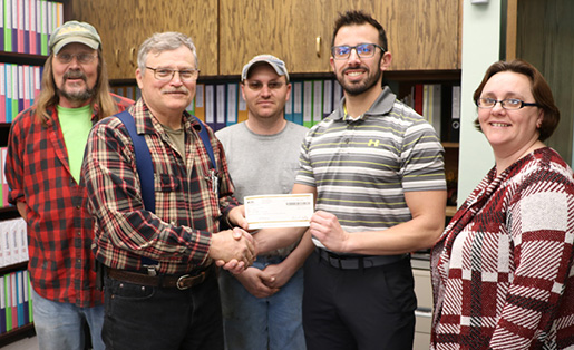 Security First Insurance Presents Dividend Check to City