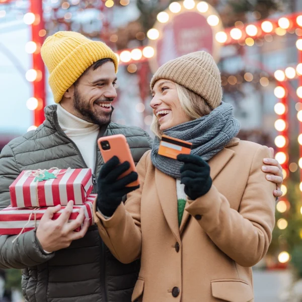 A couple Christmas shopping during the holidays.