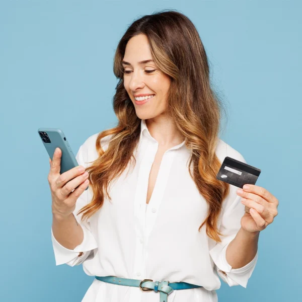 Lady using her personal credit card to purchase something on her phone