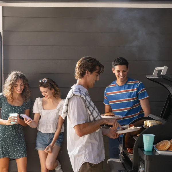 Group of friends outside grilling.